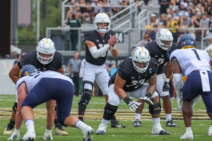 Oct 28, 2023; Orlando, Florida, USA; UCF Knights quarterback John Rhys Plumlee (10) calls for the snap against the West Virginia Mountaineers during the first quarter at FBC Mortgage Stadium. Mandatory Credit: Mike Watters-USA TODAY Sports